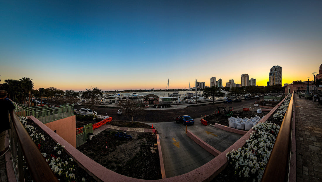 Downtown St Petersburg marina at sunset with waterfront skyline, boats, and ongoing development reflecting rising cost of living in St Pete Florida