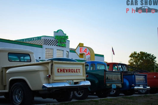 Classic Chevrolet trucks parked outside Quaker Steak & Lube in Clearwater during a car show on 49th Street North