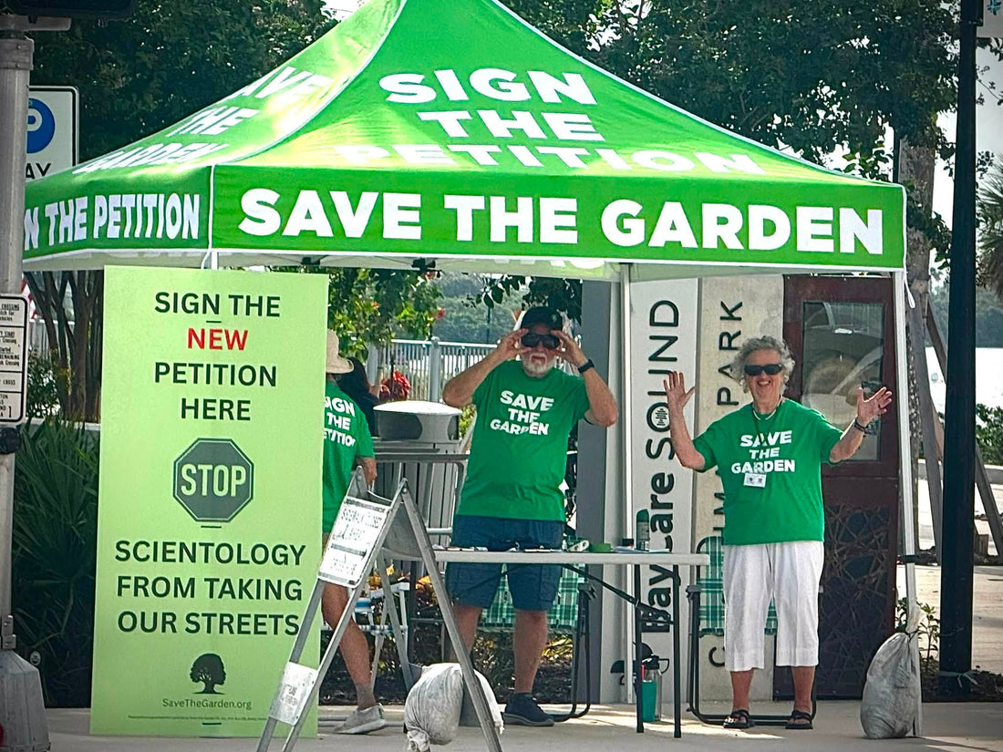 Save the Garden volunteers collecting petition signatures in downtown Clearwater to oppose Scientology taking control of South Garden Avenue.