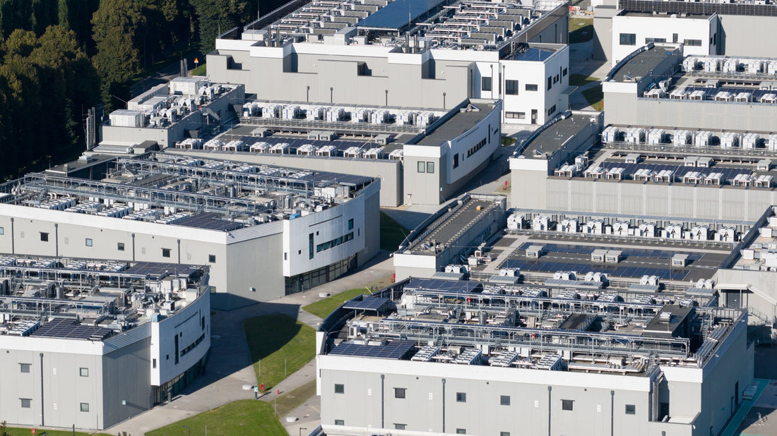 Aerial view of a large data center complex with rooftop cooling equipment and solar panels, highlighting the scale of modern AI and cloud infrastructure amid growing Pinellas County development concerns.