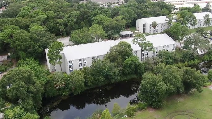 Aerial view of St. Giles Manor II senior apartment building in Pinellas Park, Florida, a six story independent living community where residents were affected by a prolonged elevator outage.
