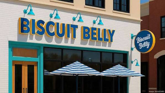 Biscuit Belly restaurant exterior with blue and yellow signage ahead of the chain’s planned downtown St. Pete expansion.