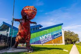 MOSI Museum of Science and Innovation exterior in Tampa with iconic red dinosaur sculpture and updated branding signage
