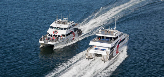 Cross Bay Ferry boats traveling across Tampa Bay between St Petersburg and Tampa with passengers on board and open water views