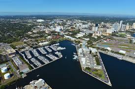 Aerial view of downtown St. Petersburg Florida waterfront and marina along Tampa Bay showing city shoreline infrastructure and seawalls near the St. Pete Pier.