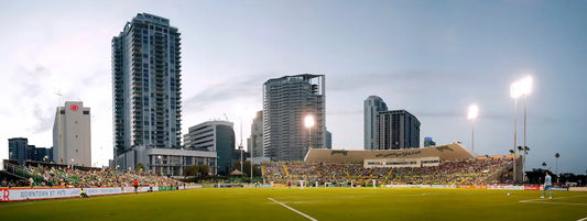 Tampa Bay Rowdies playing at Al Lang Stadium in downtown St Pete with city skyline and waterfront stadium view
