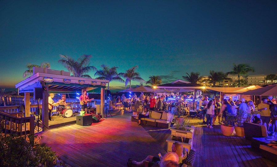Nightlife crowd at Jimmy B’s Beach Bar in St. Pete Beach enjoying live entertainment, beachfront drinks, and outdoor music venue near Gulf Boulevard